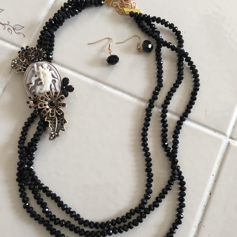 Necklace & brooch earrings included